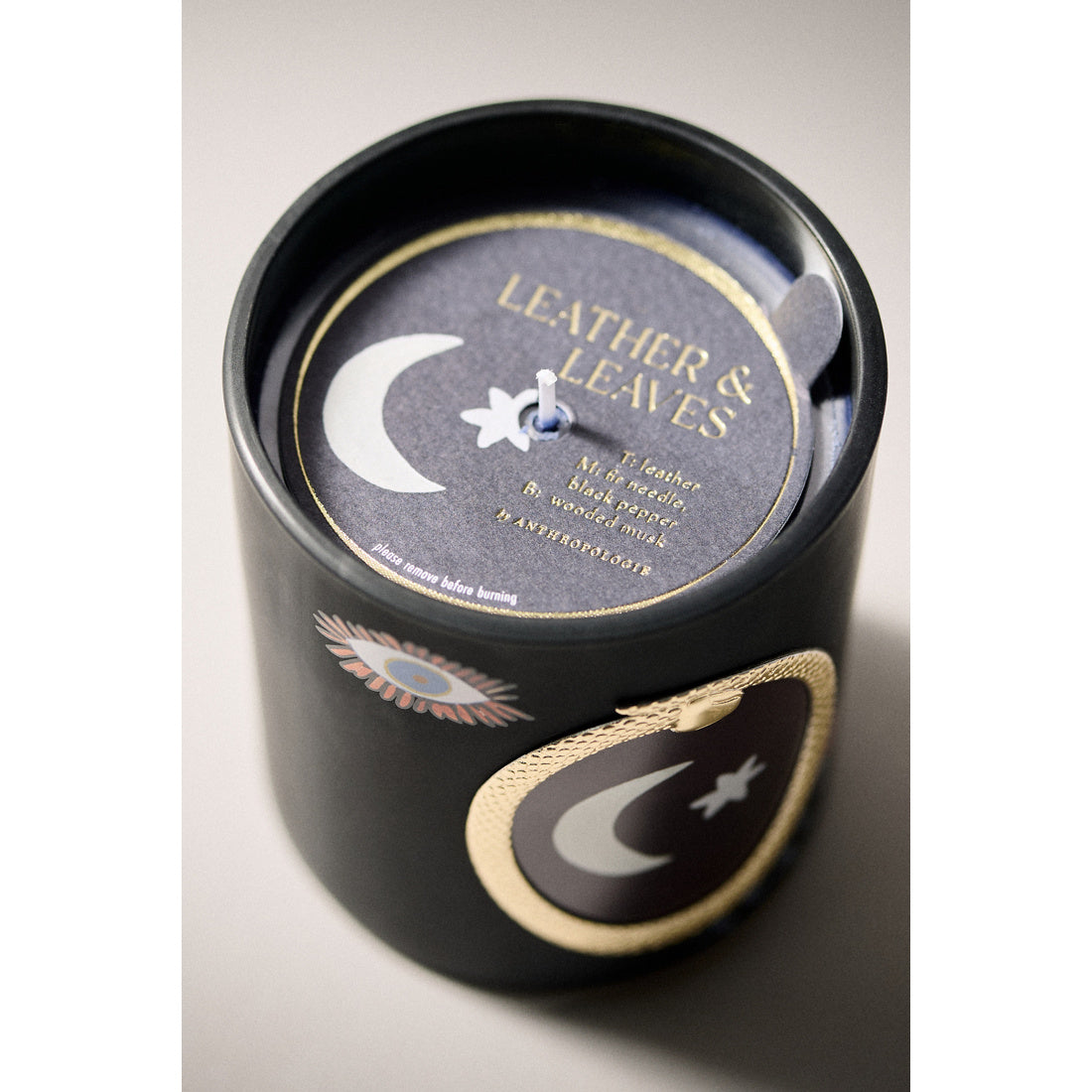 Woody Halloween Moon Leather and Leaves Glass Candle by Anthropologie