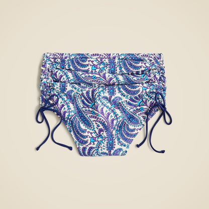 Ruched high-rise bikini bottom with adjustable side ties in purple paisley